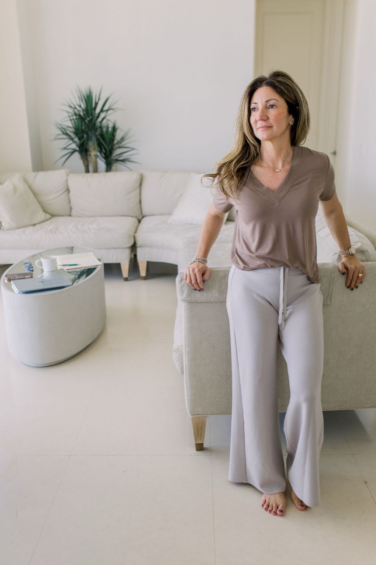 Carrie standing in her living room
