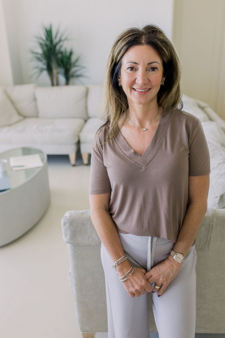 Carrie Cohen standing in her living room