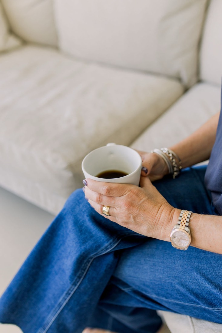 Close crop of hands holding a coffee cup
